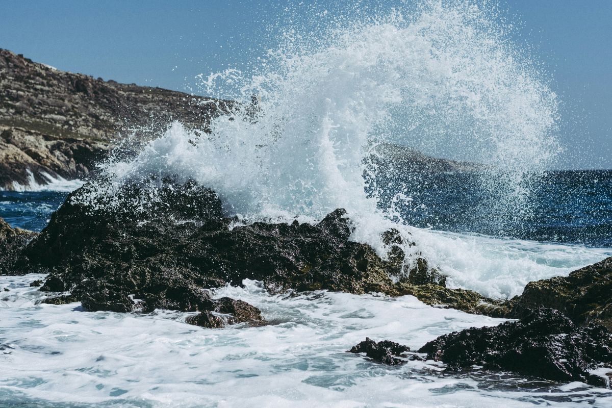 Waves breaking against a rocky coastline